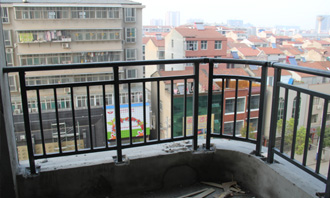 What is the height of balcony guardrail specified by the state?