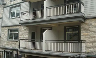 Is it necessary to set protective railings for the low windows on the first floor?